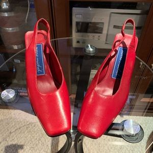 Red leather sling back shoes.